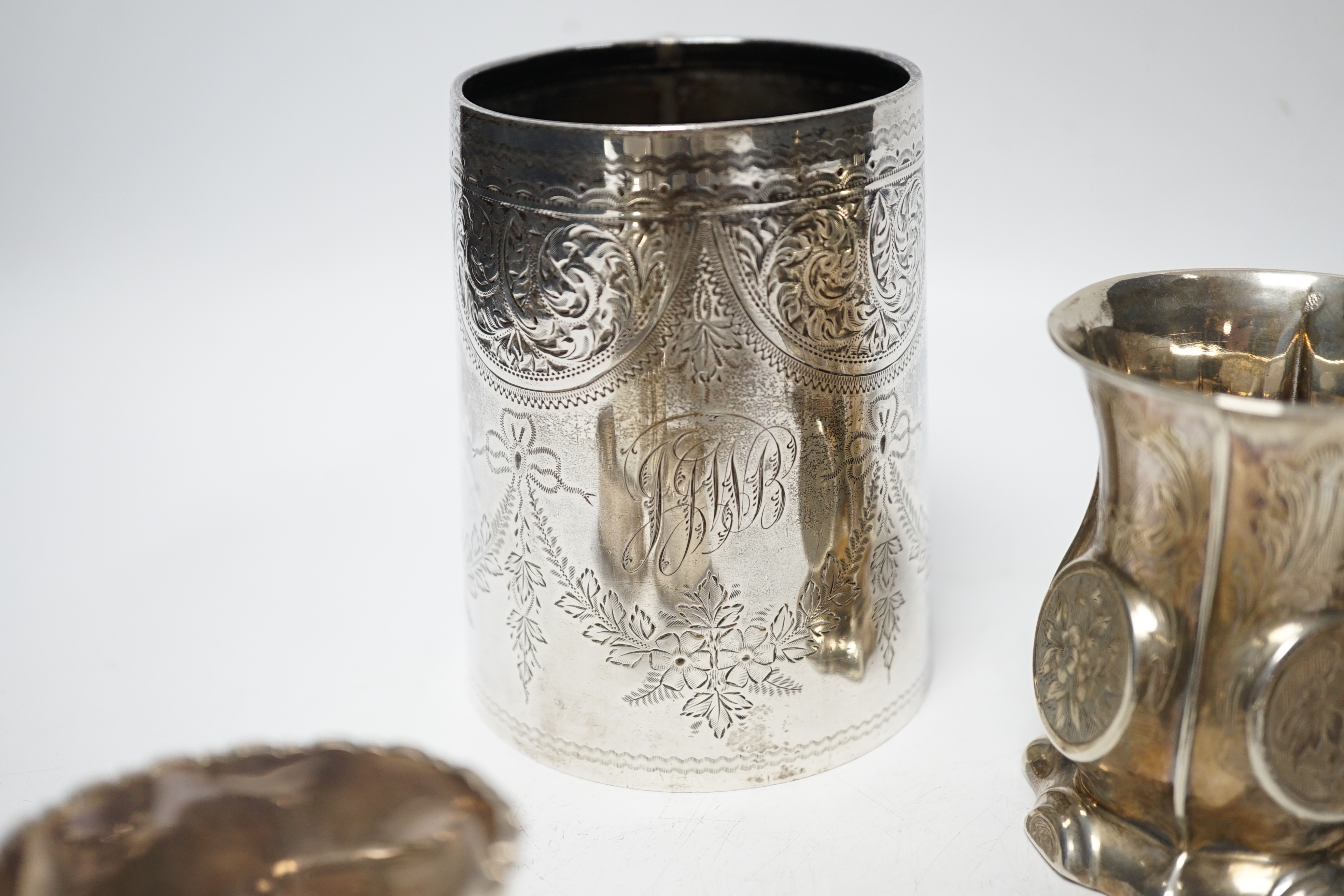 A late Victorian engraved silver mug, Hilliard & Thomason, Birmingham, 1900, 10.2cm, three assorted silver mustard pots including Victorian, a small Victorian silver christening mug and a set of six silver napkin rings,